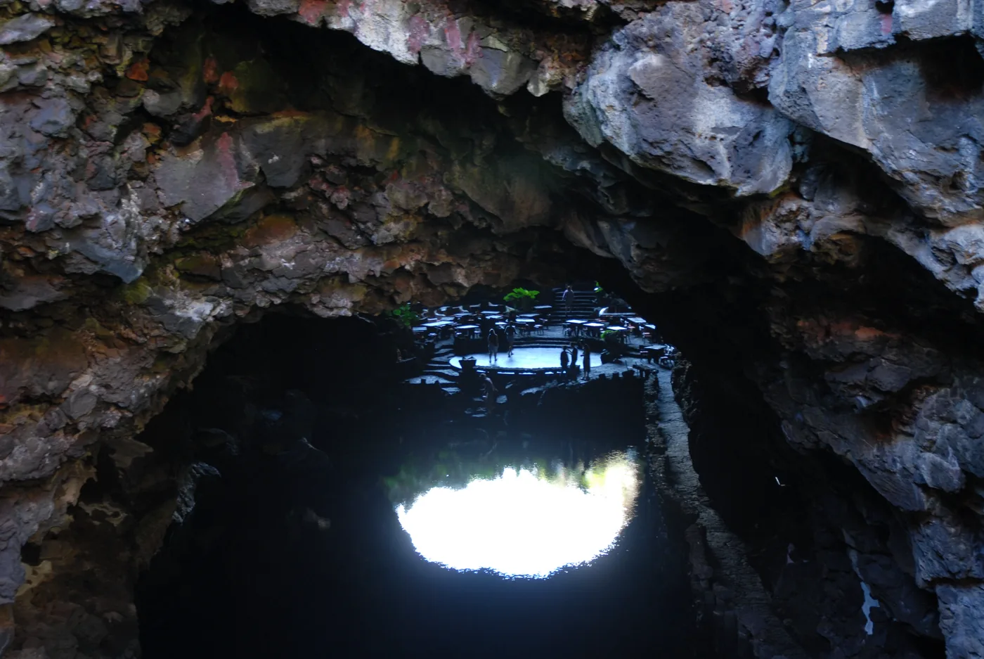 The lake inside the volcanic tube at Jameos del Agua, below the opening to the sky.